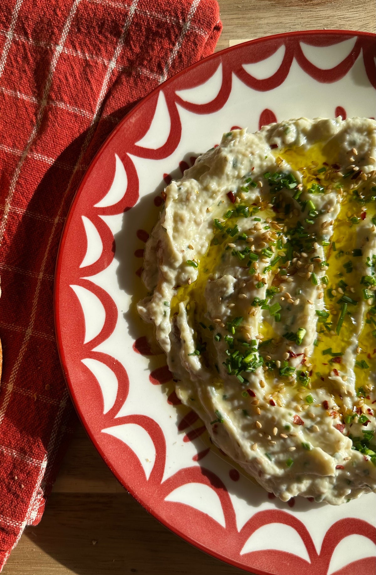 Creamy garlic confit dip with toasted sesame, parmesan and fresh chives