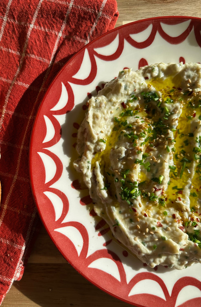 Creamy garlic confit dip with toasted sesame, parmesan and fresh chives