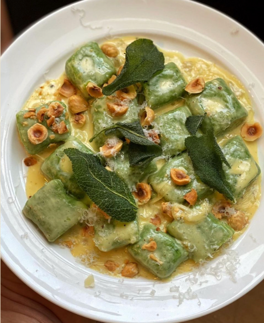 Spinach potato gnocchi with gorgonzola, hazelnut and crispy sage