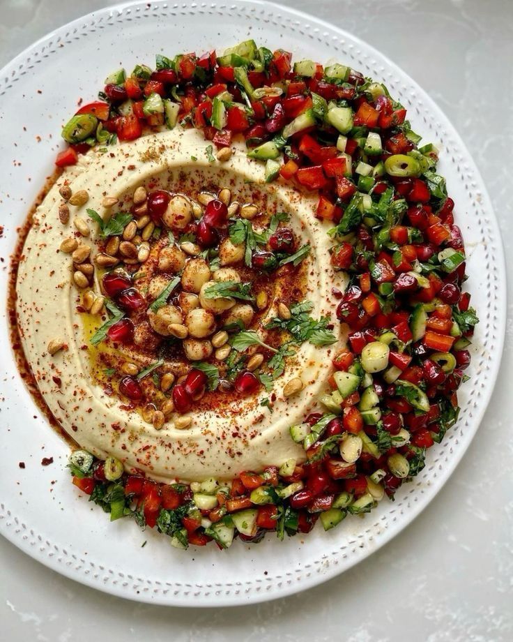Elevated hummus with crispy chickpeas, fresh herbs and vegetables